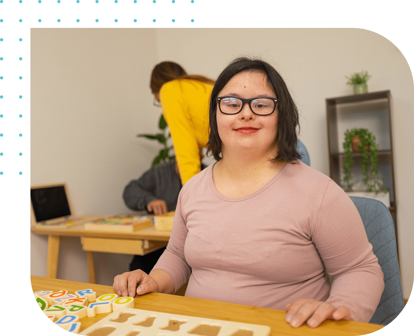 Group 1321316657 A woman sitting at a table with a puzzle.