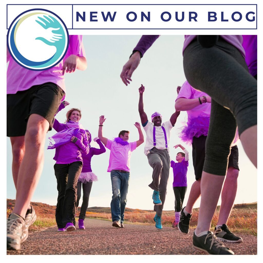Best Buddies Walks A group of people in purple shirts and black shorts.