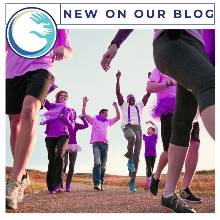 Best Buddies Walks A group of people in purple shirts and black shorts.