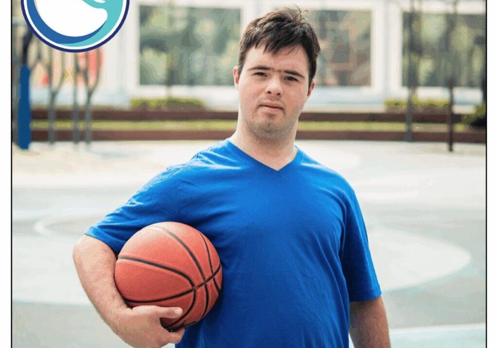 Man holding basketball on outdoor court.